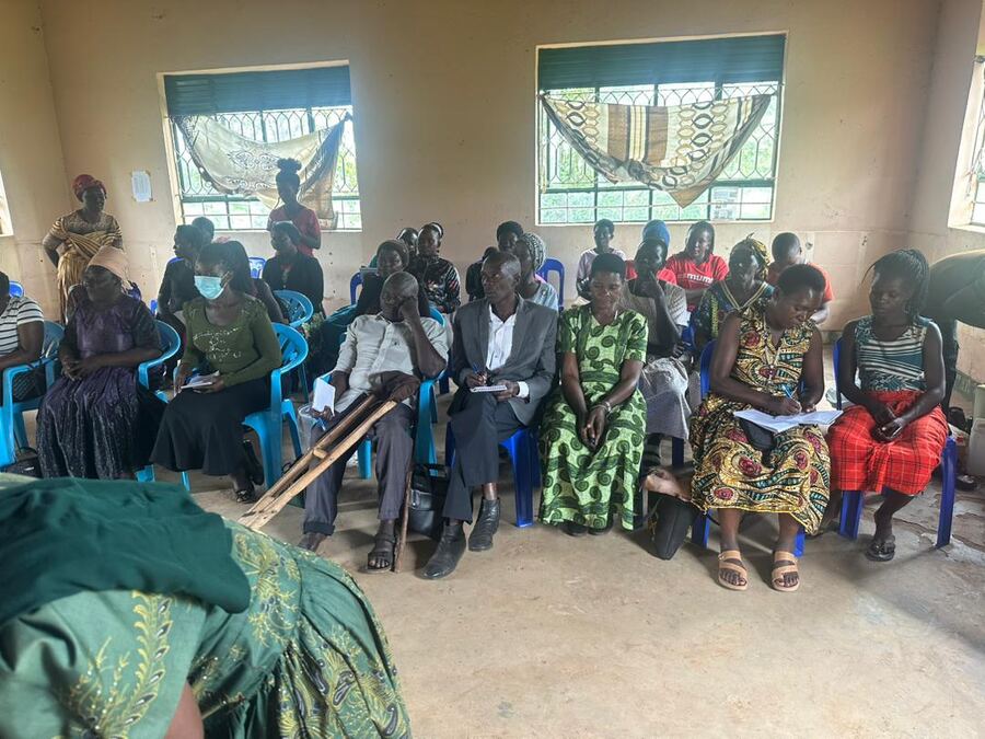 Women's group members seated during a skilling session